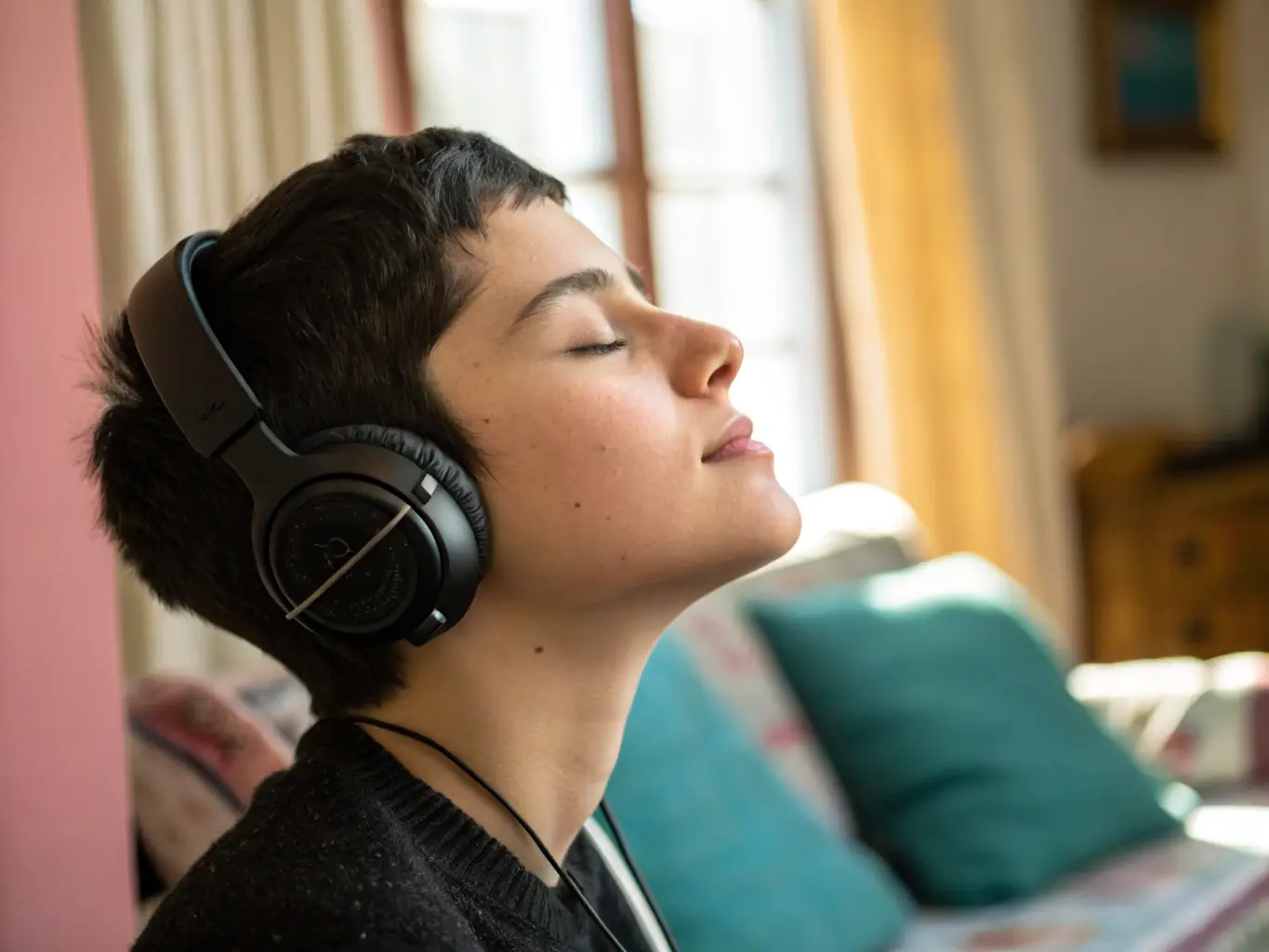 An image depicting a person listening to music with high-end headphones, visually representing the ad-free listening experience.